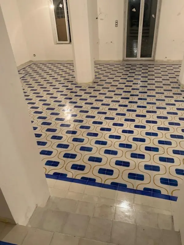 Poncage carrelage ciment